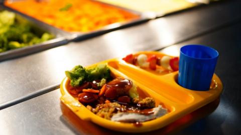 A school meal on an orange tray