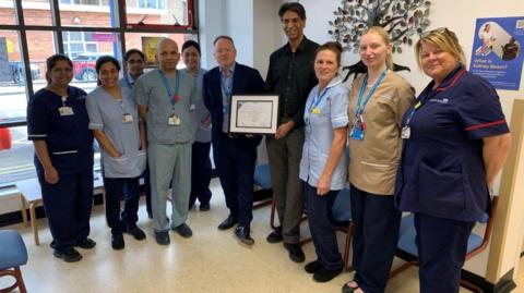Staff at the hospital with the award