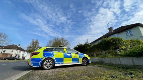 A police car parked in Avon Road in Chelmsford