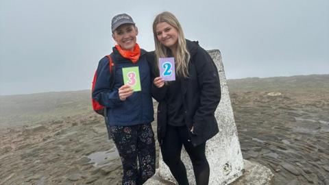 Nuttall family on top of Pendle Hill 