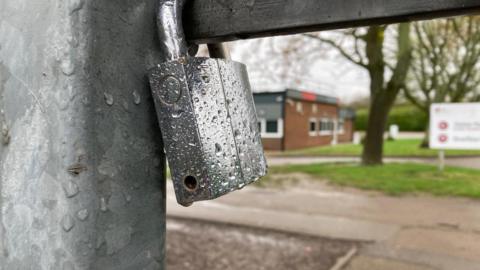 A padlocked school gate