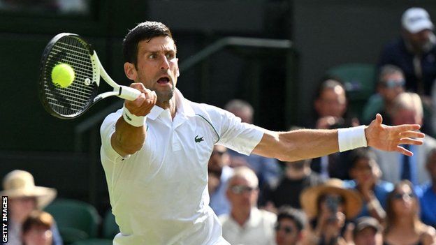 Novak Djokovic stretches for a ball against Miomir Kecmanovic in the Wimbledon third round
