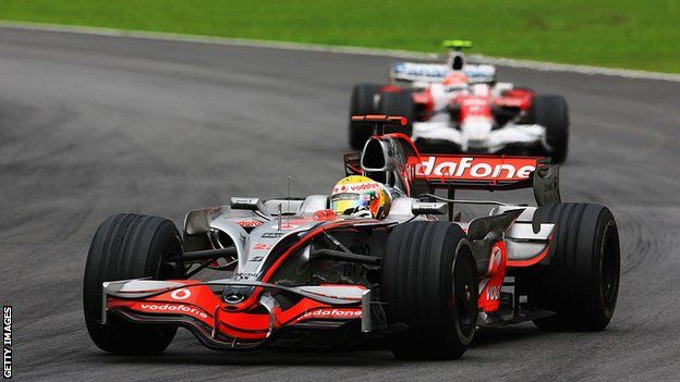 Lewis Hamilton passes Timo Glock on the final corner of the Brazilian Grand Prix