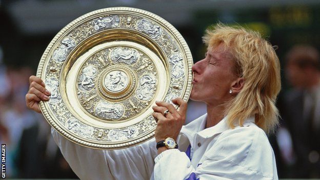 Martina Navratilova celebrates with the Venus Rosewater Dish after winning Wimbledon in 1990