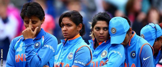 India's players look dejected after defeat against England