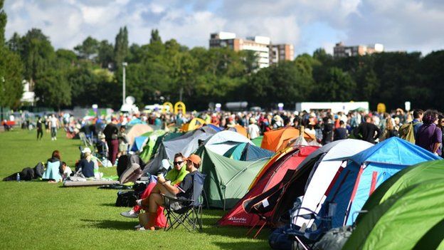 A general view of tents and people queuing on day one of Wimbledon 2019