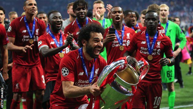 Mohamed Salah lifts the Champions League trophy with Liverpool in 2019