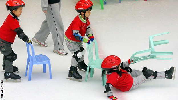 Children struggle to get to grips with ice skating