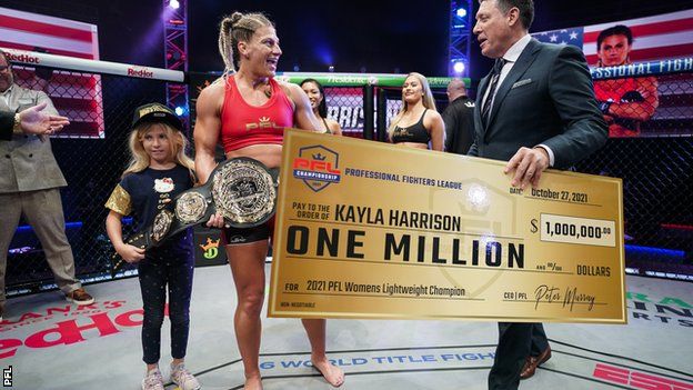 Kayla Harrison receives her $1m cheque