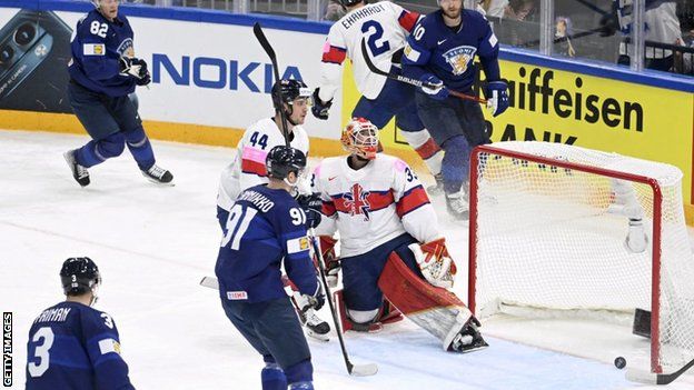 Finland's forward Joel Armia scoresagainst Great Britain
