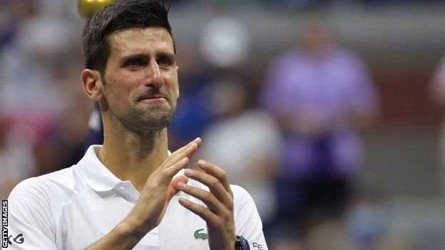 Novak Djokovic applauds the New York crowd