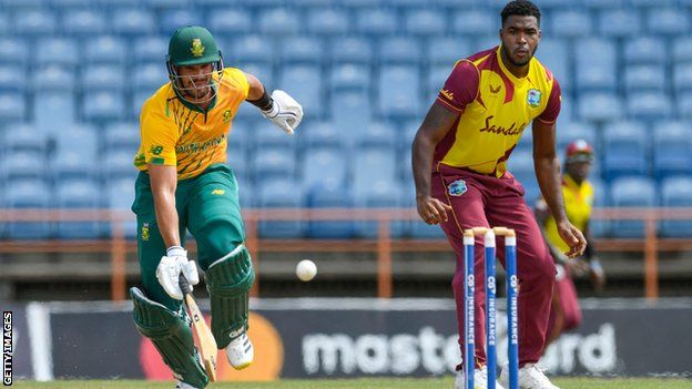 Aiden Markram of South Africa returns safe after an attempted run out by Obed McCoy of West Indies