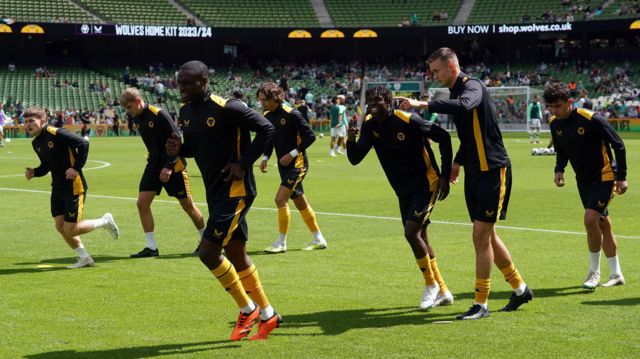 Wolves players warm up before a friendly against Celtic