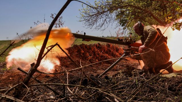 Ukrainian solider firing an anti-tank grenade launcher at a front line near Bakhmut on 3 May