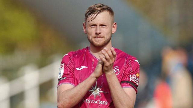 Harry Darling celebrates Swansea's win at Huddersfield