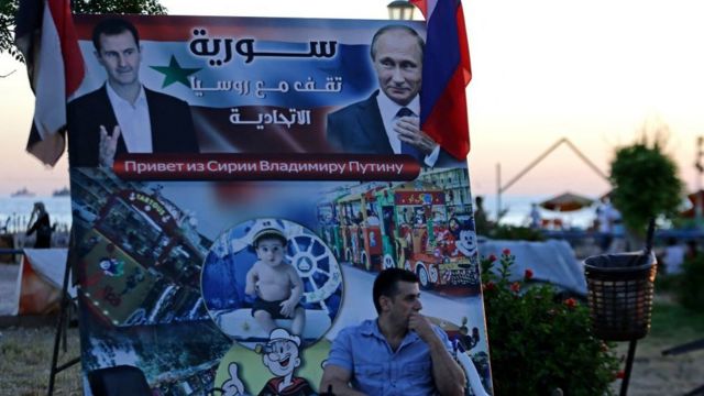 Плакаты с Асадом и Путиным