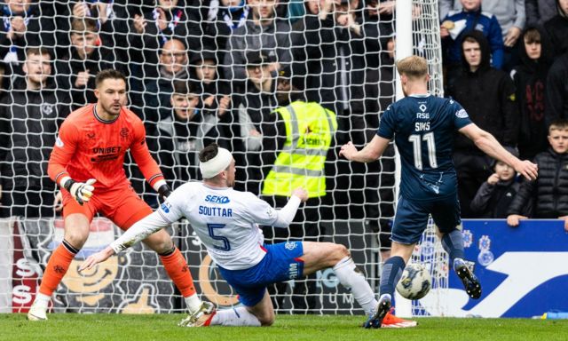 Rangers goalkeeper Jack Butland faces up to Simon Murray