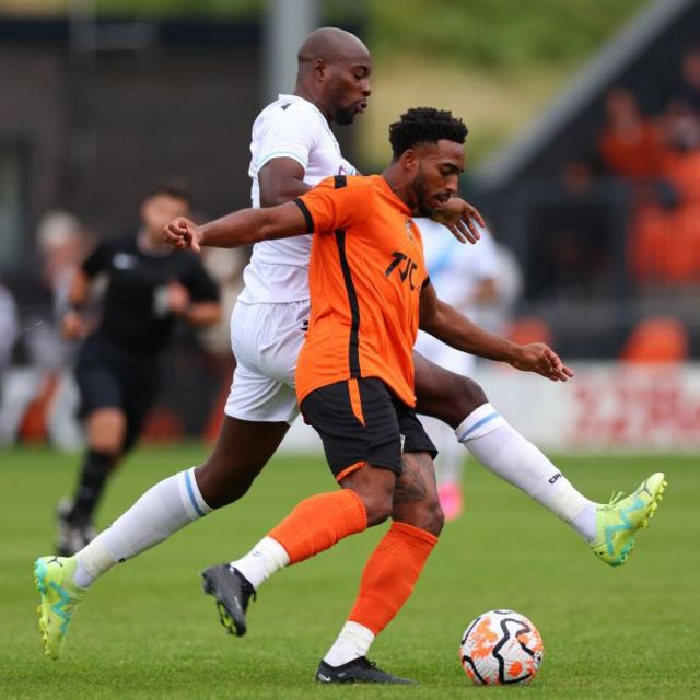 Jean-Philippe Mateta of Crystal Palace in action with Reece Hall-Johnson of Barnet