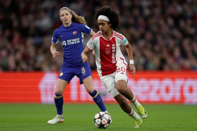 Lily Yohannes of Ajax Women facing Chelsea