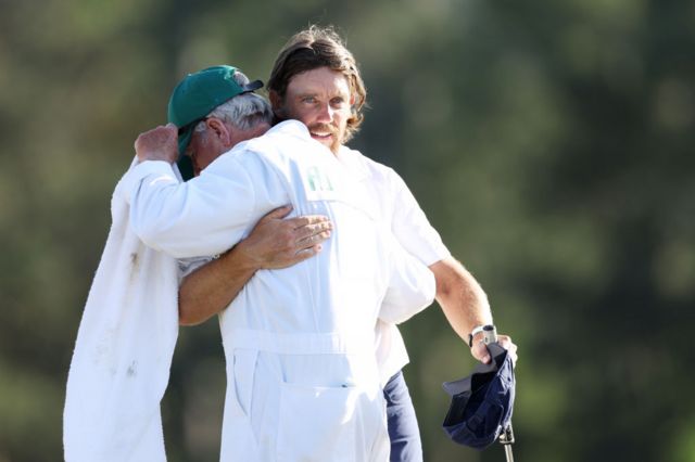Tommy Fleetwood embraces caddie Gray Moore