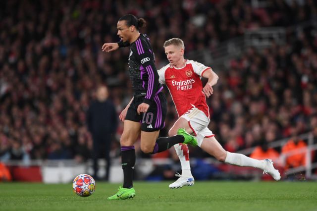 Oleksandr Zinchenko chases Leroy Sane