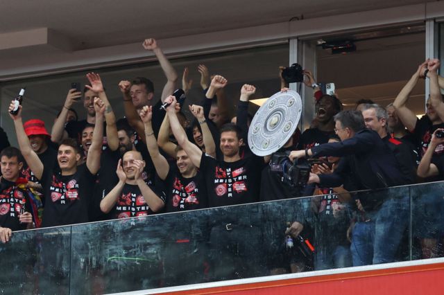 Xabi Alonso celebrates winning Bundesliga.