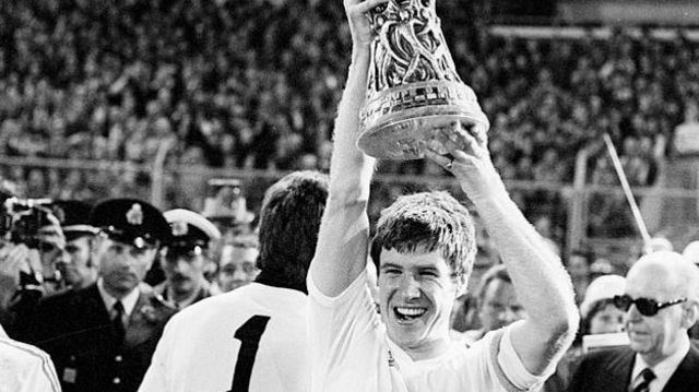 Liverpool captain Emlyn Hughes lifts the winning trophy after 1976 UEFA Cup Final Second Leg match between Club Brugge and Liverpool