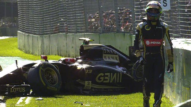 Pastor Maldonado walks away from his stricken Lotus
