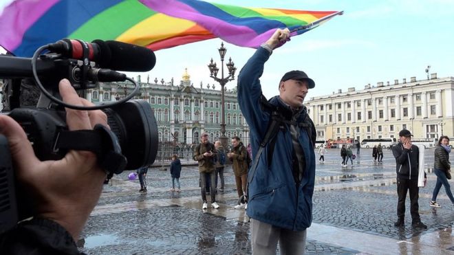 Yury Gavrikov with a rainbow flag