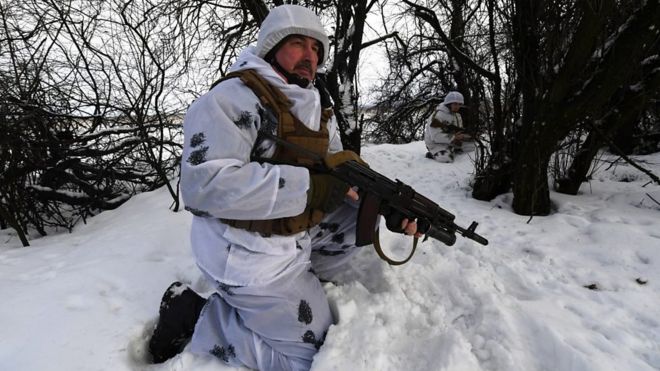 Ukrainian soldier wearing winter disguise
