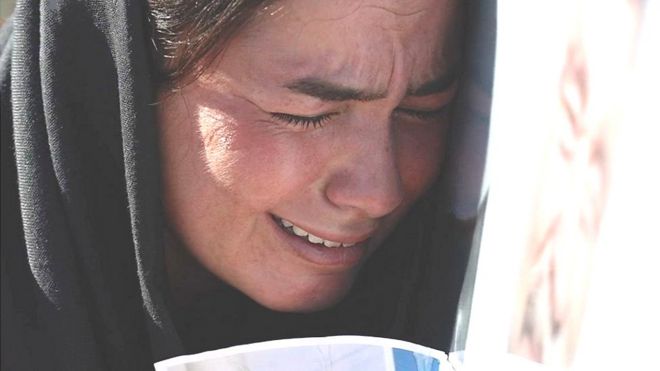 Иракская женщина плачет