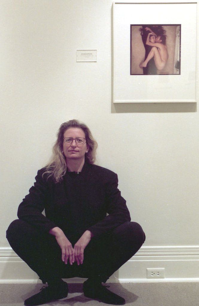 Annie Leibovitz at the Museum of Fine Arts, Houston, Dec. 15, 1993, in from of her iconic photo of John Lennon and Yoko Ono