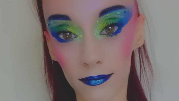 Selfie of Michaela Harris wearing colourful make up