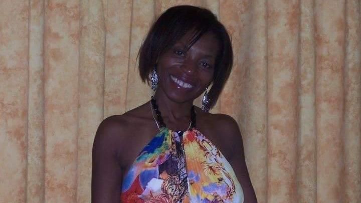 A photo of Yvonne Smith wearing a colourful dress in 2009