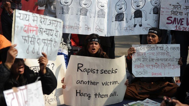 Indian protestors holds placards as they shout slogans during a protest against last month"s gang rape and murder of a student, in New Delhi on January 29, 2013.