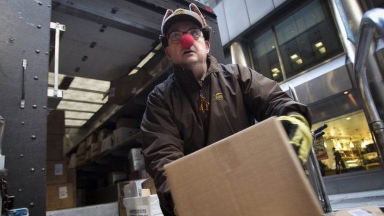 UPS delivery man unloads packages in New York on 24 December