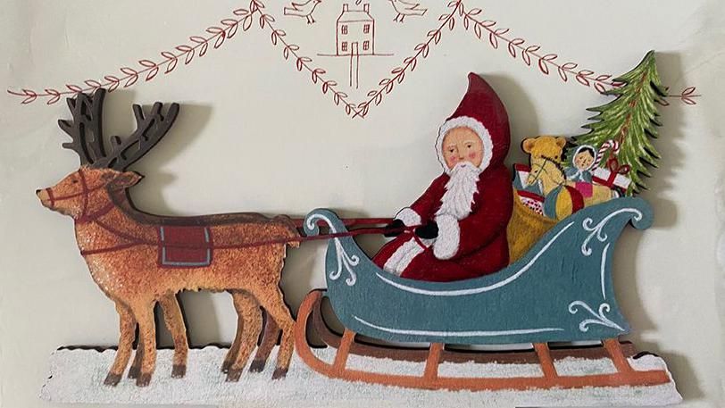 An Elizabeth Harbour design of Santa Claus in his sleigh being pulled by a reindeer