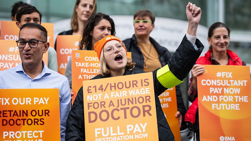 Junior doctors and consultants at University College Hospital London with placards