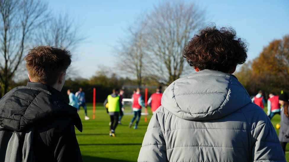 Young people watching on training at Ipswich Town's training ground