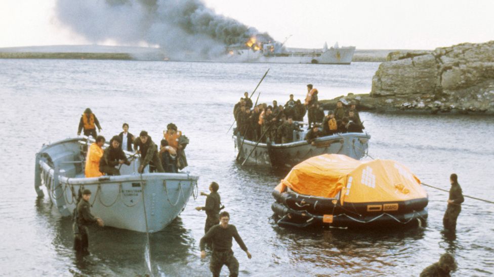 Survivors coming ashore from the bombed Sir Galahad