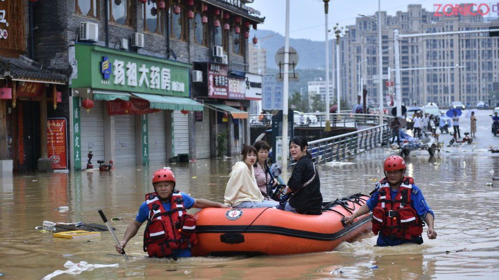 Rescuers use rubber boats to evacuate stranded people in flood water on June 19, 2022 in Jian'ou, Fujian Province of China.