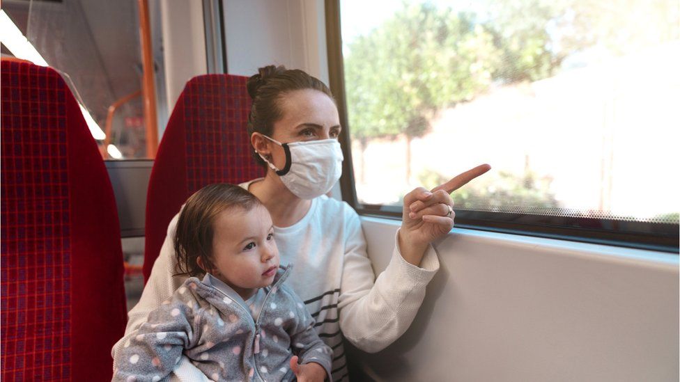 A woman and child on a train