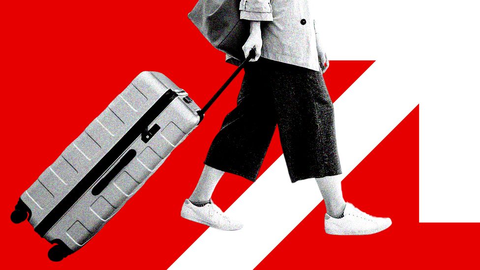 Red graphic of a woman dragging suitcase