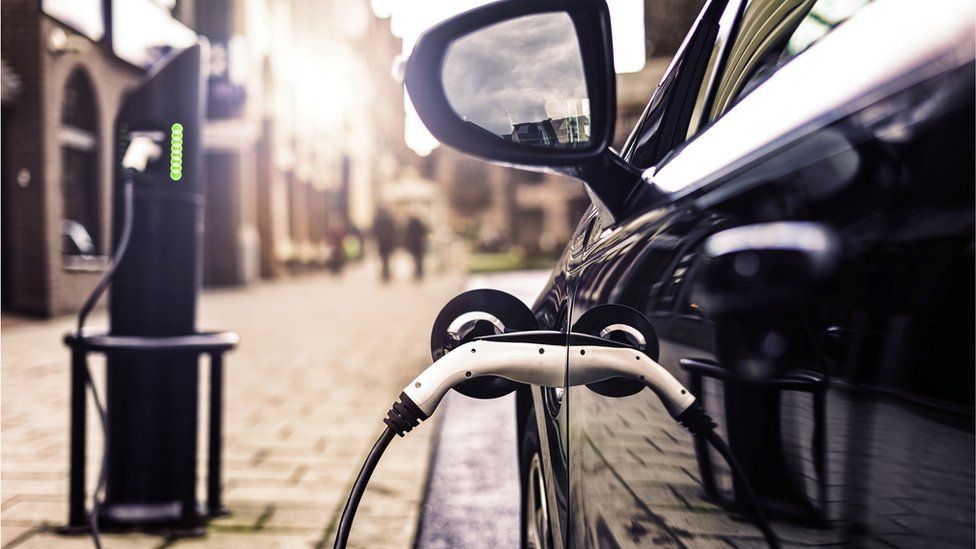 An electric vehicle at a charging station