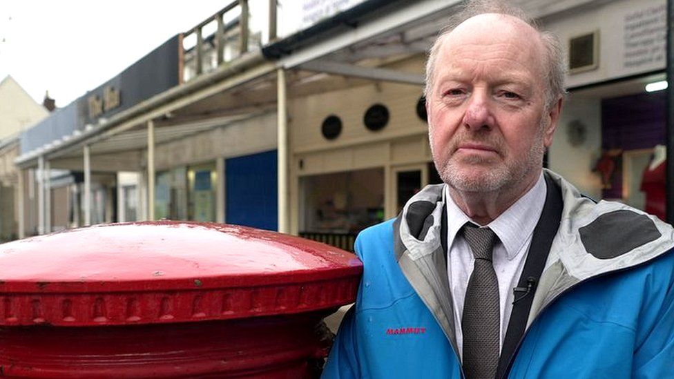 Alan Bates next to a postbox