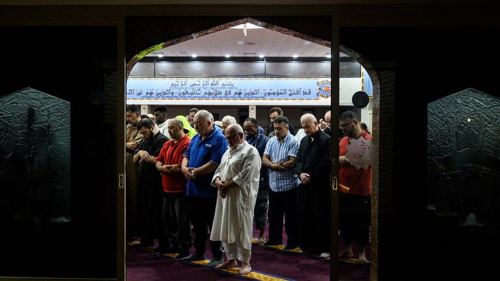 Mourners praying at a mosque in Sydney the morning after the Christchurch shootings