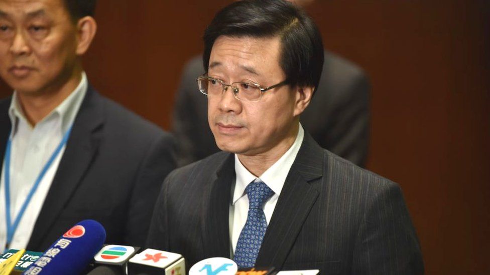 Secretary for Security John Lee speaks to journalists at the end of the first session at the Legislative Council in Hong Kong on June 19, 2019, after massive protests brought nearly two million people into the streets at the weekend.