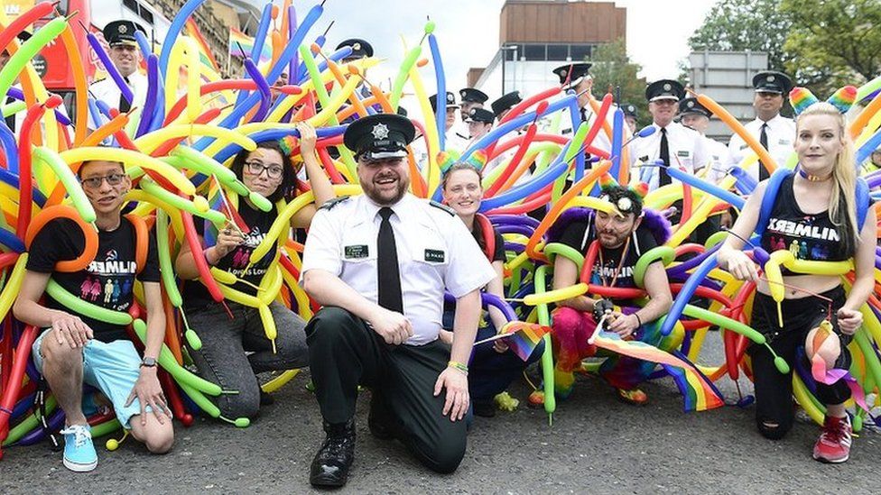 PSNI officers pose with LGBT activists at the Pride parade in Belfast in 2018