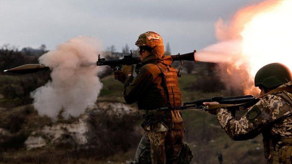 New Ukrainian army brigade recruits take part in a military exercise conducted by a foreign instructor