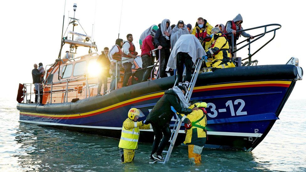 Migrants are brought to Dungeness by the RNLI after a small boat incident in the Channel